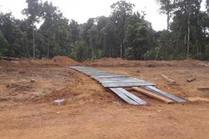 Wooden paved driveway at Puruni controlled dumpsite