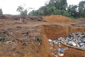 Behind the buffer wall at Puruni controlled dumpsite